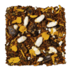 Losse blaadjes van LOOOM Creamy Kiss crème brûlée infusion: rooibos met witte gepofte stukjes, gele bloemblaadjes en donkere stukjes