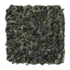 Losse blaadjes van LOOOM Green Goddess green tea: gekrulde groene theeblaadjes